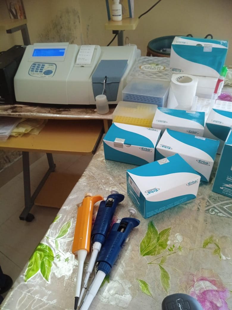 Donated analyzer with reagents and pipettes in the clinic lab
